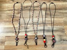 Georgia Bulldog lanyards, 17" long with breakaway clasp and black swivel hooks.  Beech wood 8mm beads with red, black, white spacers. Nylon black string with red and black hexagon silicone beads. Red Black White Beaded Lanyard, Adjustable Beaded Blue Lanyards, Adjustable Lanyard With Lobster Clasp For Personal Use, Cheap Multicolor Lanyards With Lobster Clasp, Adjustable Red Lanyard With Key Leash, Georgia Bulldogs, Silicone Beads, Beech Wood, Badge Holders Lanyard