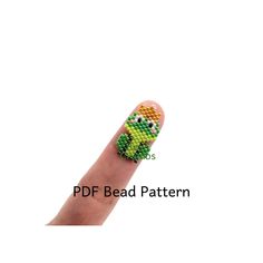 a person's finger with beads on it and the text pdf bead pattern