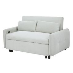 a white couch with two pillows on it