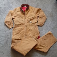 Carhartt Brown Duck Quilted/Insulated Zip Up Coverall X01 Brn Mens Size 48r Euc Pre Owned/Pre Worn Excellent Used Condition. No Tags. Zip Up/Snap Closure On Front And Side Legs. Corduroy Collar. Coveralls Accept Detachable Snap On Hood. ( Not Provided) All Snaps And Zippers Functional. Photos # 5, 6 And 7 ( Show Slight Stain/Paint From Use.) Measures Approx: 29" Inseam X Shoulder Width 20" X Pit Width 25" Rise(Waist To Inseam 15" X Shoulder To Inseam 36". Perfect Coveralls For The Cold Weather Season. Thanks For Looking. Wbct#2 Winter Workwear Overalls With Pockets, Fitted Winter Overalls With Pockets, Long Sleeve Overalls With Pockets For Outdoor, Cotton Long Sleeve Overalls For Winter, Long Sleeve Overalls For Winter Workwear, Carhartt Jackets, Weather Seasons, Men Carhartt, Snap Closure