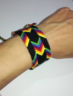 a person's arm with a colorful bracelet on it