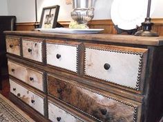 an old dresser has been painted white and brown