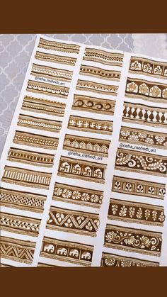 gold and white stickers with different designs on them