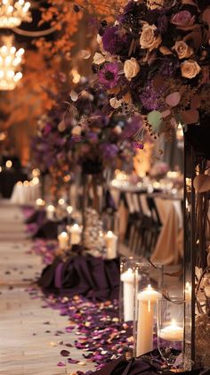 a long table with candles and flowers on it