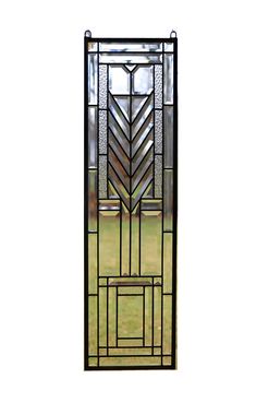 a stained glass door with an arrow design on the front and side panels in black