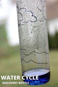 a glass filled with water sitting on top of a window sill