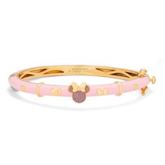 Fill your days with magic and joy with this delightful Minnie Mouse bangle bracelet, an accessory to feel as happy as anyone in Disney World! The beautiful yellow gold-plated bracelet has a sweet, two tone Minnie Mouse charm on top that is filled with a darker pink glitter and finished with her golden bow. The sides are adorned with Minnie’s iconic bows and other cute golden details. The charming bangle bracelet has a 2.5 inch diameter, the perfect size for any of the ladies in your life. The lo Affordable Fine Jewelry, Golden Bow, Disney Jewelry, Pink Enamel, Birthstone Earring, Gold Plated Bracelets, Pink Bracelet, Pink Glitter, Cute Jewelry