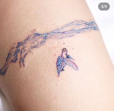 a woman's thigh with a tattoo design on it