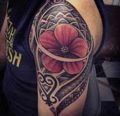 a woman with a tattoo on her arm and flower in the middle of her arm