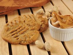 peanut butter and cookies on a wooden table