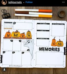 an open planner with pumpkins on it next to some pencils and markers,