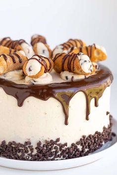 a cake covered in chocolate and marshmallows on top of a white plate