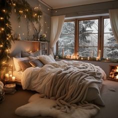 a bedroom decorated for christmas with candles and lights on the windowsill, bed in foreground