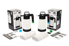 two white and black vacuums next to each other in front of a box with towels