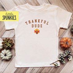 Retro Autumn Boys Outfits, Thankful Dude Natural Shirt, Turkey Shirt PRODUCTION TIME Little Spunkies from the designer/owner of Spunky Pineapple Co https://www.etsy.com/shop/SpunkyPineappleCo   All baby and toddler clothes are 100% designed and printed with water based ink. All orders placed before 12:00 pm EST are shipped out same day (Monday - Friday). Orders received after noon are shipped out the next business day. ONESIES® BRAND Made from 100% Cotton. We print on Onesies® Brand. T-SHIRT Made from 100% Cotton. These run true to size. If you are in between sizes we suggest sizing up. ADULT T-SHIRT Made from 100% Cotton. WOMEN For a relax fitting tee order the size you normally wear. If you would like a more fitted look then order a size down. MEN For a more relaxed fitting tee order up Retro Autumn, Boys Outfits, Turkey Shirts, Shirt For Boys, Thanksgiving Shirt, Baby And Toddler, Thanksgiving Shirts, Toddler Clothes, Toddler Tees