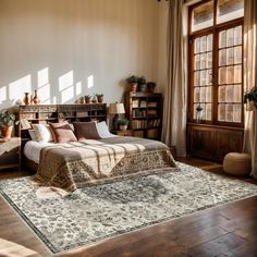 a bedroom with a large bed and lots of plants on the windows sills