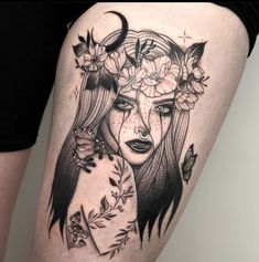 a woman's thigh with flowers and butterflies on her head, in black and white