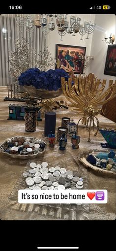 the table is covered with plates and candles, which are on display for everyone to see