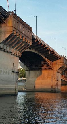 an old bridge spanning the width of a river