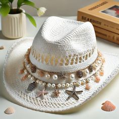 Another dream beach hat #Cowgirl #HatStraw #HatBeach #AccessoriesSeashell #HatStarfish #HatPearl #HatCoastal #StyleBeach #FashionSummer #HatBeach #Charm #HatWestern #StyleBoho #ChicVacation #StyleCoastal #AccessoriesTrendy #HatHat #PhotographyStylish Cowgirl Beach Hat, Burned Hats, Straw Cowgirl Hat, Hat Decoration, Unique Hats, Cowgirl Hat, Dream Beach, Diy Hat, Cowgirl Hats