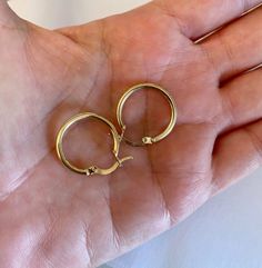 SOLID 14K Yellow Gold Hoop Earrings - Made to last a lifetime! Measurements : Diameter 20 mm Thickness 2 mm Weight about 1.5 grams Sold as a pair. The Earrings will be sent gift-wrapped and packed in a padded envelope to maintain the product Our jewelry are water resistant and comes with 1 year warranty Thank you for your interest. Please check out our other items and be sure to add us to your favorites! https://www.etsy.com/shop/Limajewelry We look forward to the opportunity of serving you. Polished Finish Hoop Huggie Earrings As Gift, Hallmarked Hoop Huggie Earrings For Gift, Small Hoop Yellow Gold Earrings, Hypoallergenic 14k Gold Hoop Earrings, Gift Hallmarked Hoop Huggie Earrings, Small Polished Hoop Earrings As A Gift, Small Hoop Earrings With Polished Finish As Gift, 14k Gold Hoop Earrings With Polished Finish, 14k Gold Tarnish Resistant Hoop Earrings