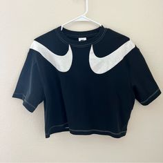 Nike Color White And Black Size S Never Worn Good Quality Trendy Nike Workout Tops, Trendy Nike Sports Tops, Sporty Black Tops With Logo Print, Black Sporty Top With Logo Print, Black Workout Top With Logo Print, Nike Sporty Tops, Nike Sporty Tops For Sports Season, Trendy Black Sports Top, Black Crew Neck Activewear For Spring