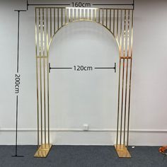 the measurements for an iron and wood arch are shown in front of a white wall