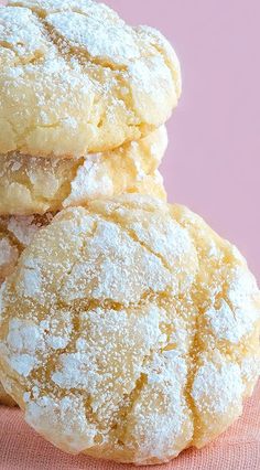 three powdered sugar cookies stacked on top of each other