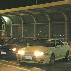 there are many cars that are parked in the parking lot at this time of night