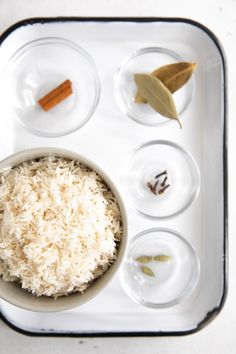 an overhead view of rice and spices on a tray