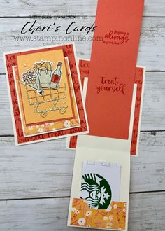 three cards with the starbucks logo on them, one is in a card box and another has an envelope