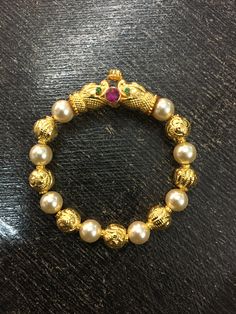 Pearl Kadas Indian Gold, Pearl Bangles Gold, Baby Jewelry Gold, Kids Gold Jewelry, Gold Jewels Design, Gold Jewelry Outfits, Black Beads Mangalsutra Design, Gold Earrings Models