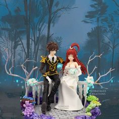 a bride and groom figurine sitting on a bench in front of a forest