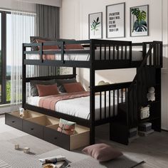 a bunk bed with drawers underneath it in a room next to a window and pictures on the wall