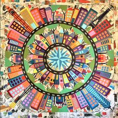 a colorful quilt with lots of different colored buildings in the center, and a circular design on