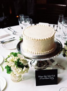 a white cake sitting on top of a table