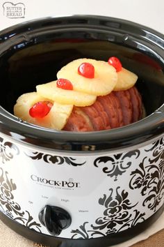 a crock pot with some food inside of it on top of a table cloth