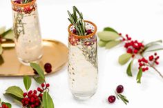 Christmas Mimosas are such a fun way to get in the holiday spirit! This super easy cocktail will be a hit at all of your holiday parties, Christmas Poinsettia Drink, Christmas Mimosas, Christmas Popcorn Tins, Mimosa Drink, Cranberry Mimosa, Christmas Popcorn, White Cranberry Juice, Mimosa Recipe, Homemade Cocktails