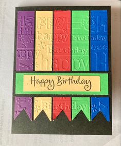 a happy birthday card with colorful ribbons and the words happy birthday written in black ink