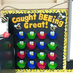 a sign that says caught beeing great with many cups in front of the board