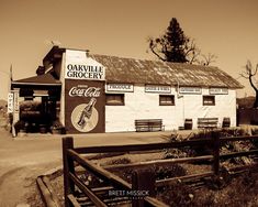 an old building with a sign on the side of it that says oakville grocery