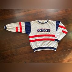 Vintage *Pre-Owned* 1980’s Adidas Crewneck Sweatshirt Always 100% Authentic Estimated Size Is Large Red/White/Blue Multicolored - Color Block Small Spot On Chest Near Neckline - Circled/Highlighted In Photos Truly Amazing Condish For Its Age Approx Measurements Taken Laid Flat Pit To Pit: 25” Shoulder To Hem: 26” Waistline: 18” Sleeves: 27” Will Ship Securely Packed/Tracked Negotiable - Obo Trusted/Reliable Seller Hit Me Up With Any Questions/Offers Adidas Crewneck, Red Adidas, Red White Blue, Adidas Men, White Blue, Crewneck Sweatshirt, Color Block, Red And Blue, Red White