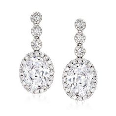 Ross-Simons - 5.70 ct. t.w. Cubic Zirconia Drop Earrings in Sterling Silver. A lovely pair to flaunt with your evening wear! Dazzling 5.00 ct. t.w. oval brilliant-cut CZs are adorned by an additional .70 ct. t.w. round brilliant-cut CZs, creating drop earrings that leave you sparkling like diamonds. Set in polished sterling silver. Hanging length is 1". Post/clutch, CZ drop earrings. CZ weights are diamond equivalents.