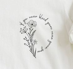 a white t - shirt with black lettering and flowers on the front, which reads if you never heard your name