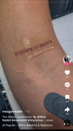 a person's arm with an inscription on it