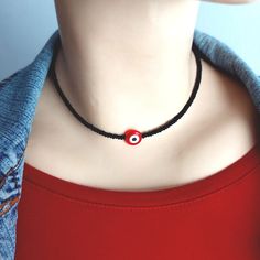 "A fantastic black matte beaded necklace with red evil eye talismans.  The black seed beads are 2x3mm and the red evil eye bead is 12mm in diameter . The sizes 12\"/30.5cm and 14\"/35.5cm have + 2\"/5cm extender chain and will fit most people but if you need other size please feel free to contact me and I will gladly make one just for you! The findings are high quality silver tone metal alloy. **This listing is about ONE  necklace** PROSESSING TIME: The time I need to prepare an order for shipping varies. For details, see individual items. I'll do my best to deliver your orders faster. IMPORTANT -Please be aware that the colors may be slightly different from reality due to the different resolution of the screens, the daylight when the photo was taken. -Also jewelry that has semiprecious st Black Bohemian Jewelry With Evil Eye, Black Bohemian Evil Eye Jewelry, Black Evil Eye Jewelry For Festivals, Black Evil Eye Round Beads Jewelry, Nazar Necklace, Red Evil Eye, Black Beaded Necklace, Evil Eye Protection, Black Bead Necklace