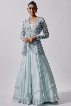 Featuring a sky blue lehenga in georgette base. It is paired with a matching organza jacket having cutwork and sequins embroidery, including a top. #perniaspopupshop #whatiworewastrending #ppuslove #lehenga #shlokdesign Jacket Lehenga Designer, Crop Top Lehenga With Jacket, Sky Blue Lehenga, Cutwork Dress, Organza Jacket, Crop Top Lehenga, Crop Top Jacket