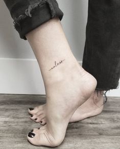 a woman's foot with a small tattoo on the ankle that reads, i love you