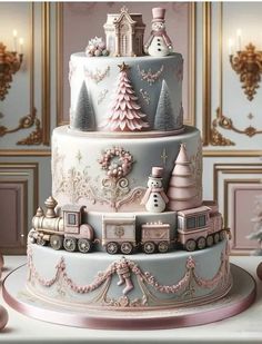 a three tiered cake decorated with pink and white frosting trees, snowmen and trains