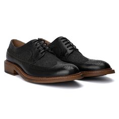 The irresistible Garret shoe by Vintage Foundry Co. exceeds expectations for a classic pair of oxfords. With its delicate design and dual-tone construction, this lace-up style stands out and demands a second look. Perfectly blending timeless elegance with a modern twist, the Garret shoe elevates any outfit, whether formal or smart-casual. Its distinctive look and superior craftsmanship ensure you make a memorable impression, combining sophistication with a bold, eye-catching design. Black Wingtip Lace-up Shoes With Textured Sole, Black Wingtip Dress Shoes With Leather Sole, Black Lace-up Shoes With Leather Sole And Wingtip Design, Black Oxford Lace-up Shoes With Plain Toe, Black Wingtip Oxfords With Textured Sole, Black Wingtip Brogue Lace-up Shoes, Black Oxford Lace-up Shoes, Black Oxford Lace-up Shoes With Rubber Sole, Black Business Oxfords With Textured Sole